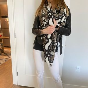Cute large animal print scarf in neutral colors.